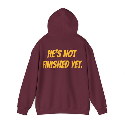 Unisex Heavy Blend Hoodie - "He's Not Finished Yet" Motivational Sweatshirt, Casual Wear, Gift for Him, Inspirational Apparel, Cozy Fashion