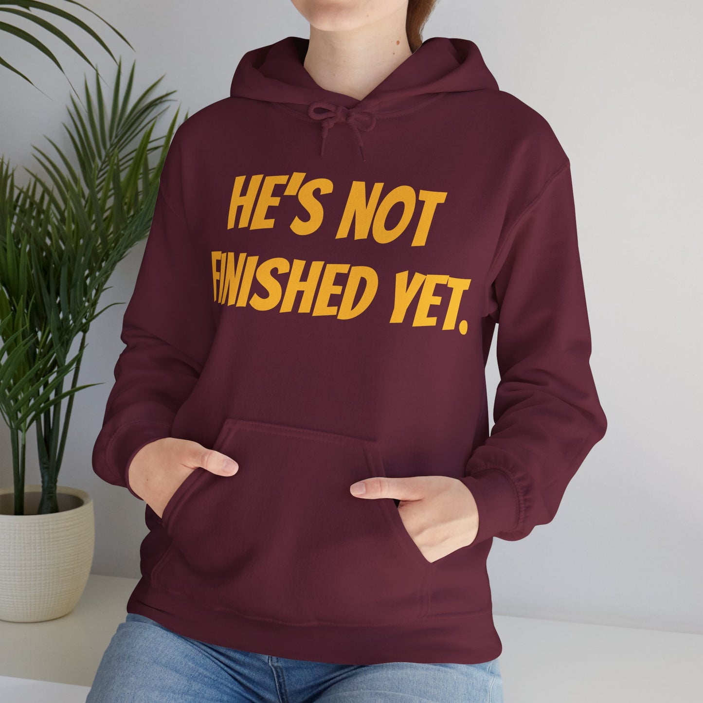 Unisex Heavy Blend Hoodie - "He's Not Finished Yet" Motivational Sweatshirt, Casual Wear, Gift for Him, Inspirational Apparel, Cozy Fashion