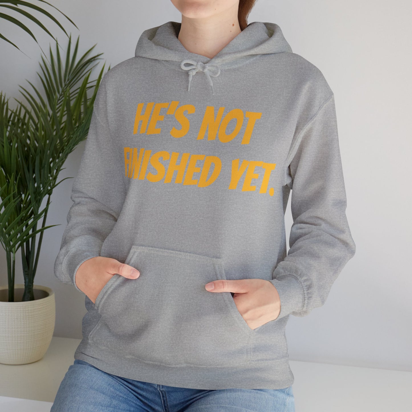 Unisex Heavy Blend Hoodie - "He's Not Finished Yet" Motivational Sweatshirt, Casual Wear, Gift for Him, Inspirational Apparel, Cozy Fashion