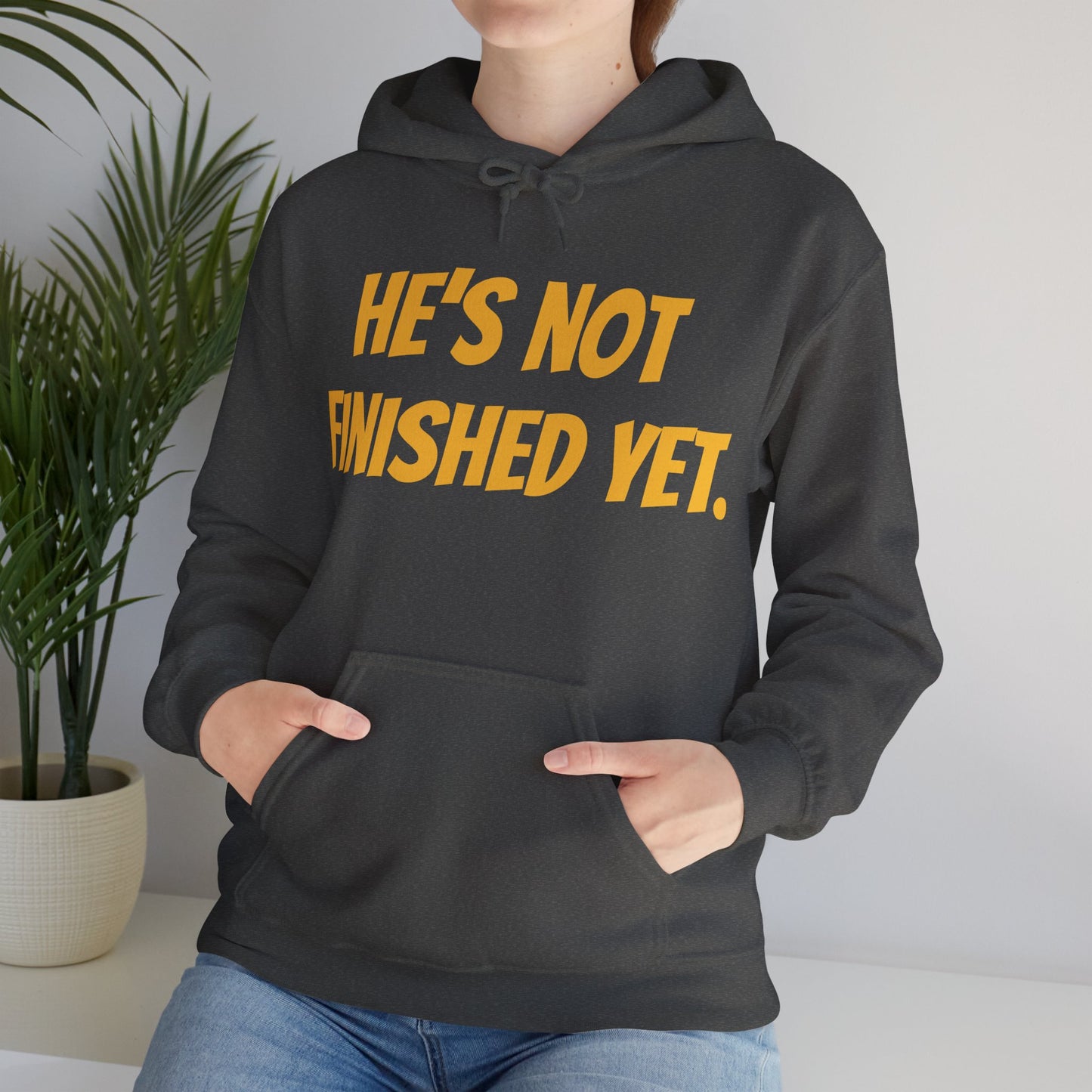 Unisex Heavy Blend Hoodie - "He's Not Finished Yet" Motivational Sweatshirt, Casual Wear, Gift for Him, Inspirational Apparel, Cozy Fashion