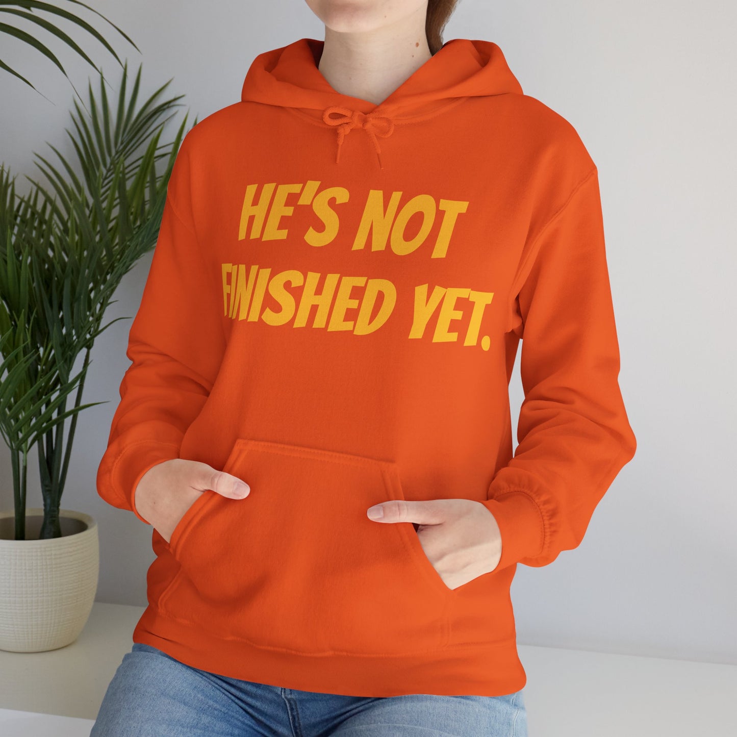 Unisex Heavy Blend Hoodie - "He's Not Finished Yet" Motivational Sweatshirt, Casual Wear, Gift for Him, Inspirational Apparel, Cozy Fashion